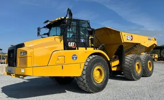 Articulated construction truck positioned on a work site